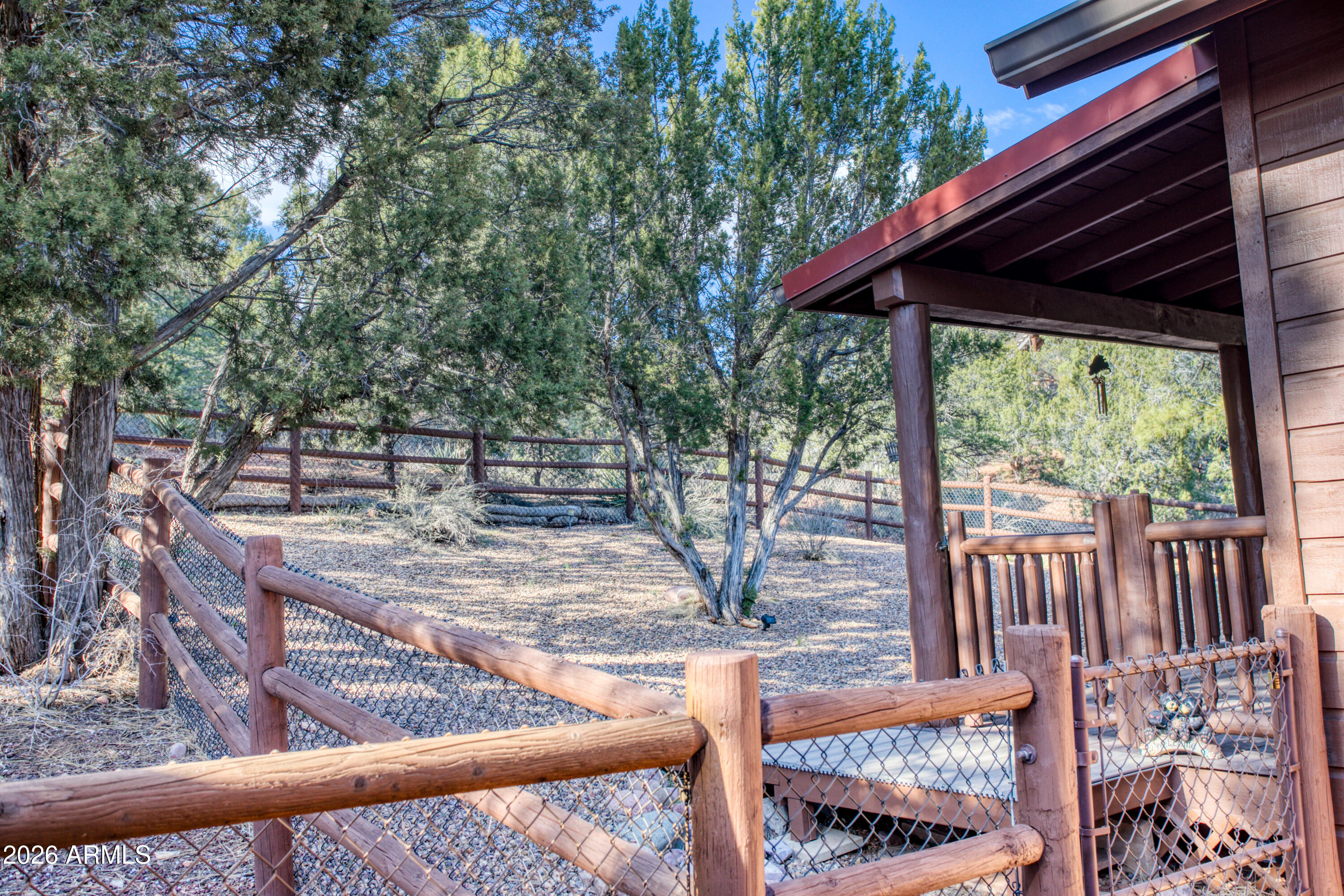 4840 West Cottage Loop Show Low, AZ 85901 - Photo 32 of 47 a view of a wooden deck next to a yard
