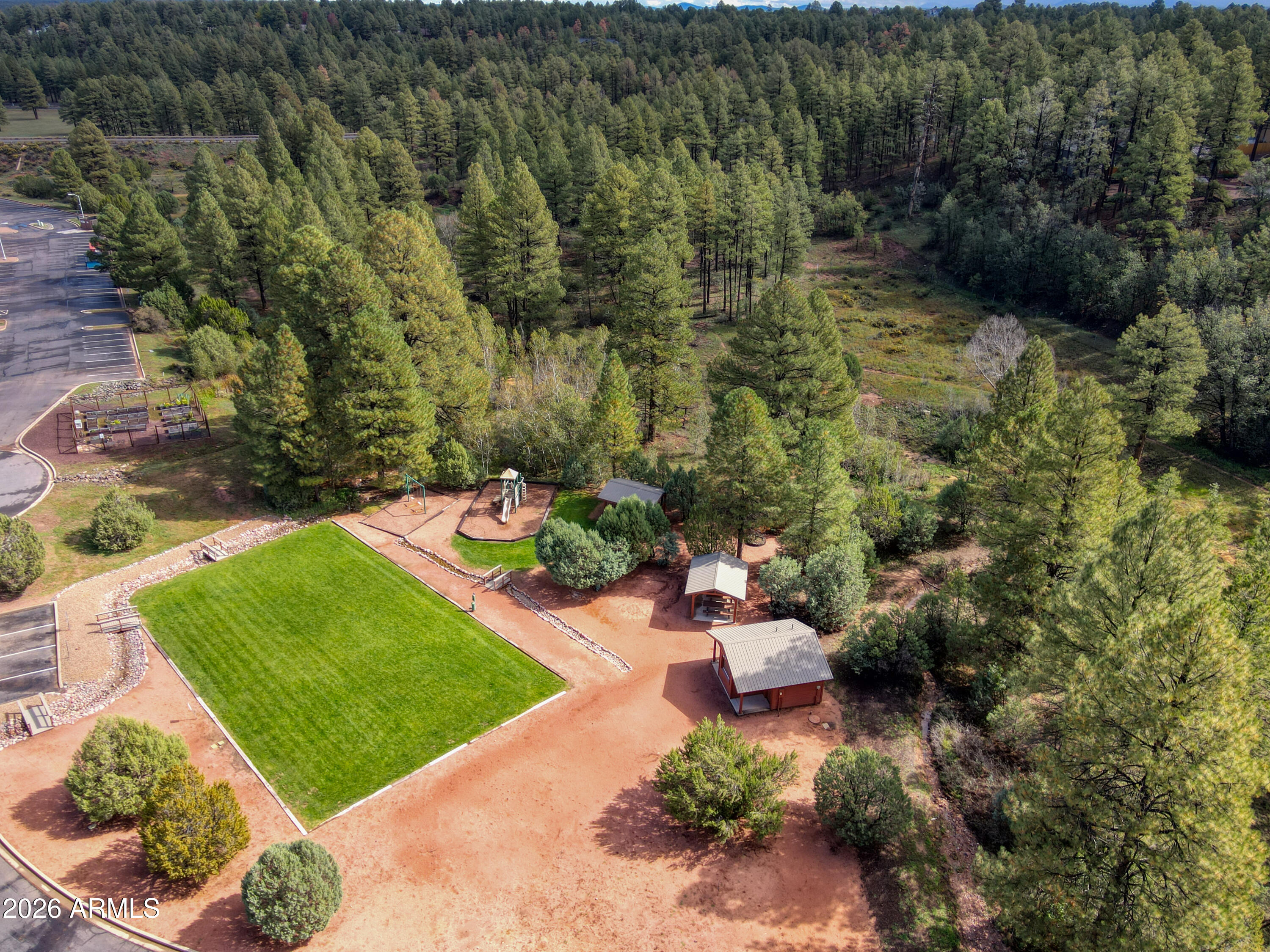 4840 West Cottage Loop Show Low, AZ 85901 - Photo 43 of 47 a view of a backyard with sitting area