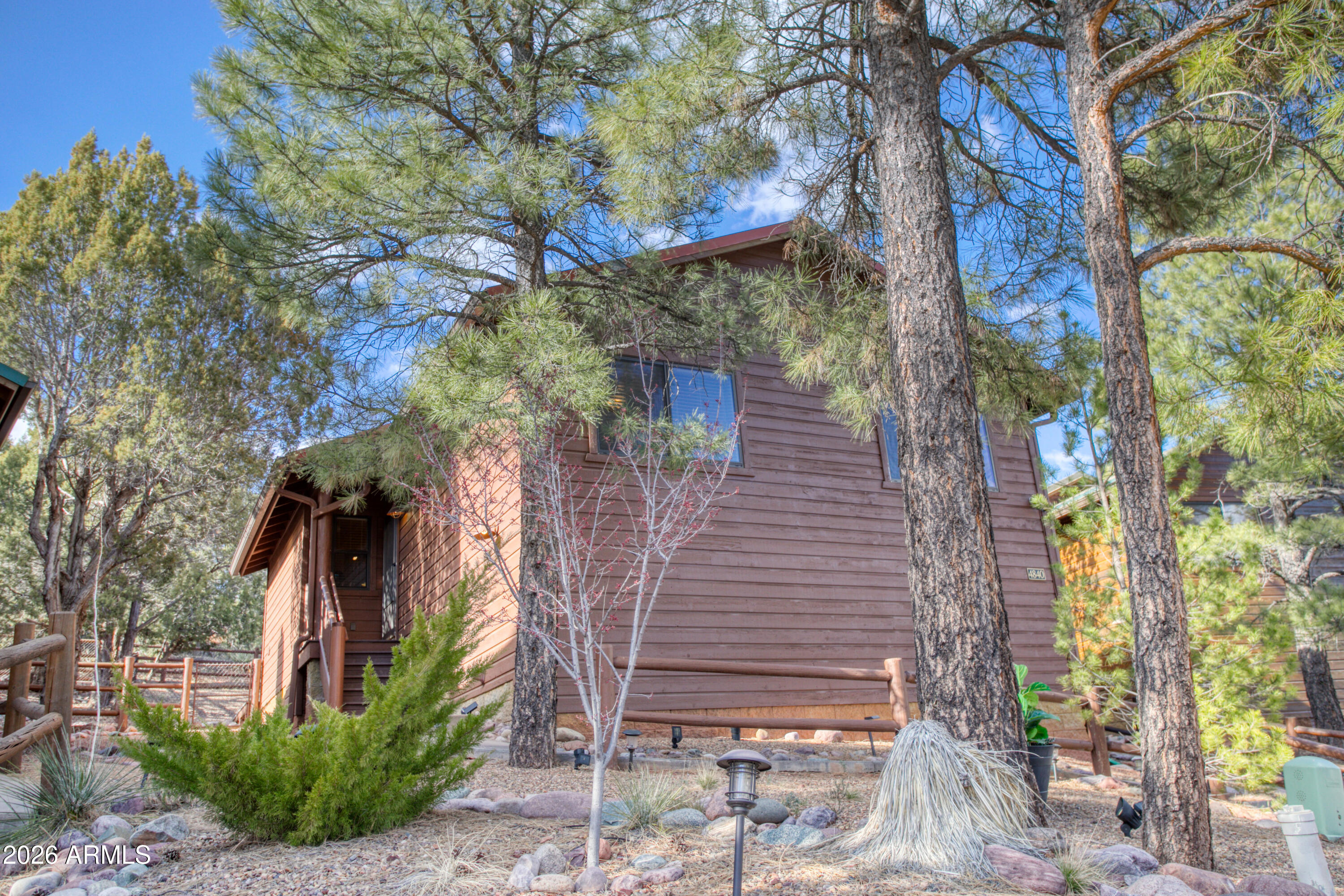 4840 West Cottage Loop Show Low, AZ 85901 - Photo 5 of 47 a view of a house with a tree