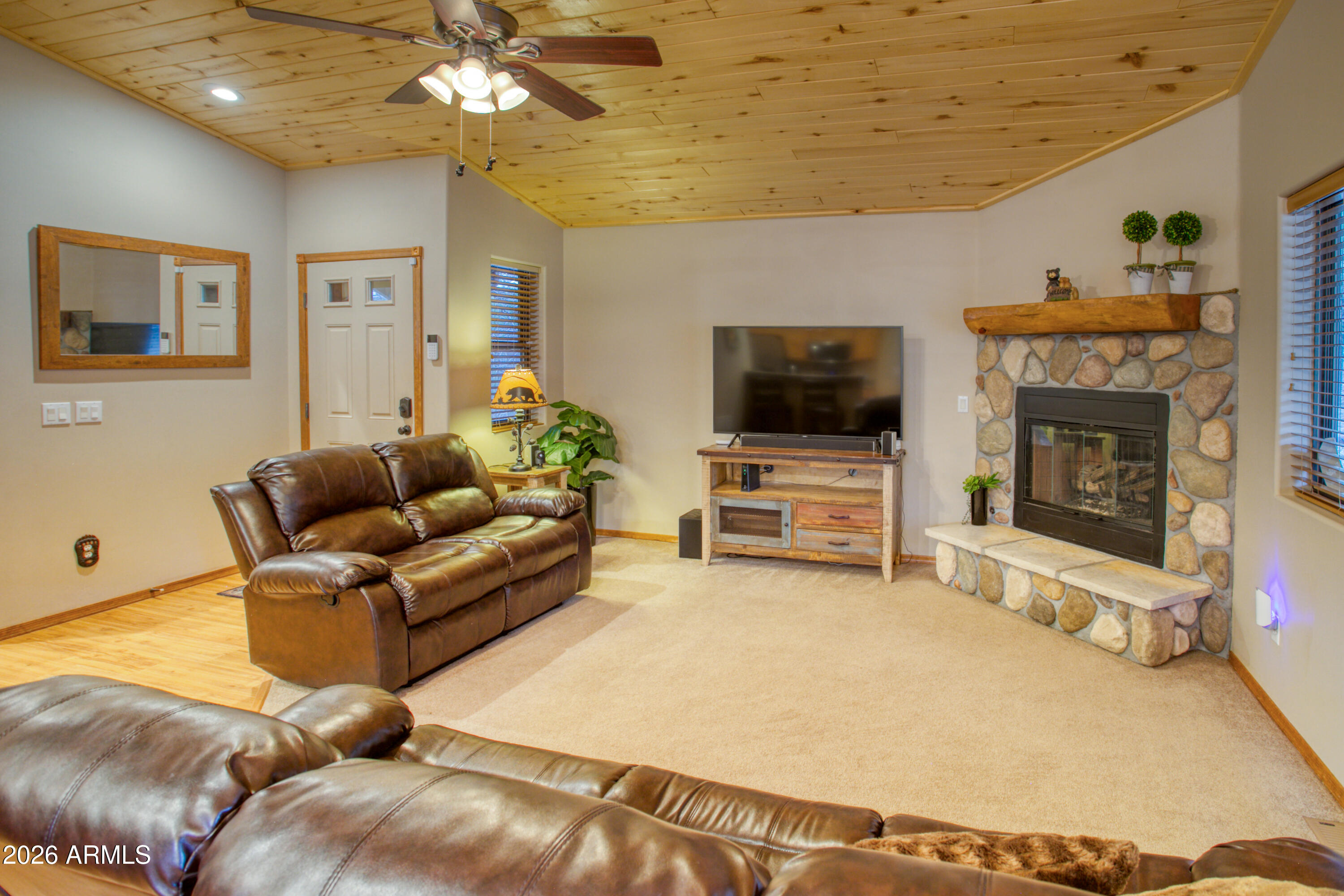 4840 West Cottage Loop Show Low, AZ 85901 - Photo 9 of 47 a living room with furniture and a flat screen tv