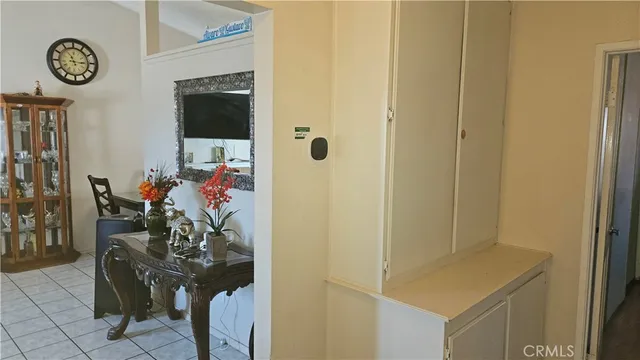 a view of a hallway with entryway and front door