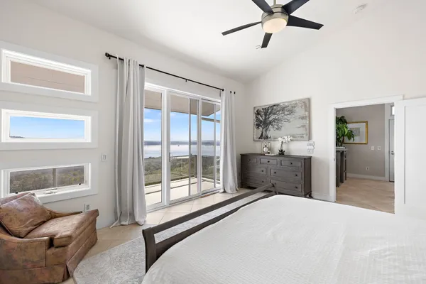 a bedroom with a bed and a night stand