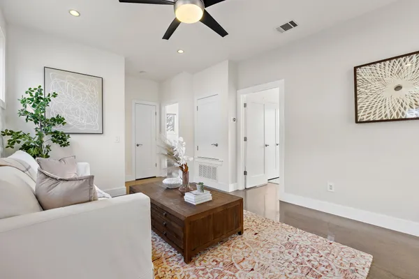 a living room with furniture and a rug