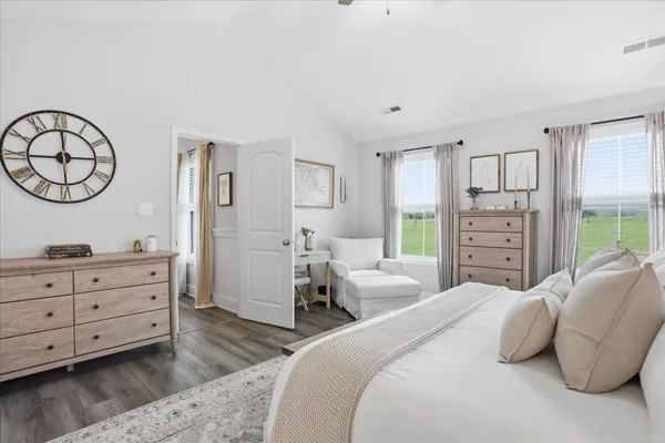 a bedroom with a bed and a dresser