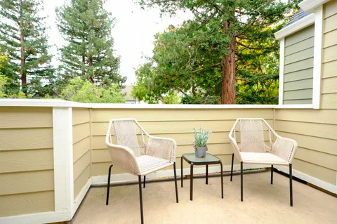 a view of a chairs and table in a window