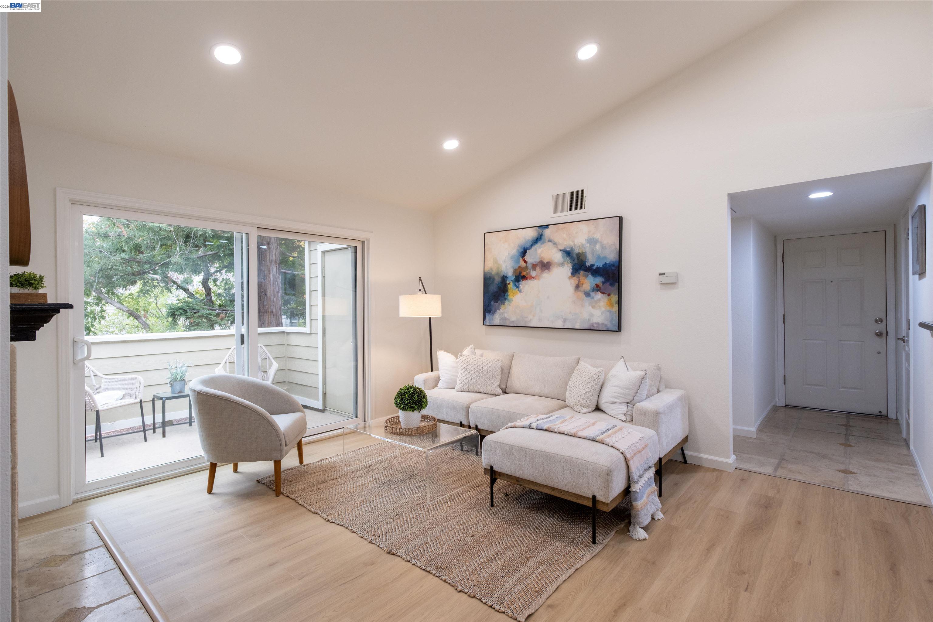 285 Reflections Drive, Unit 23 San Ramon, CA 94583 - Photo 4 of 34 a living room with furniture and a large window