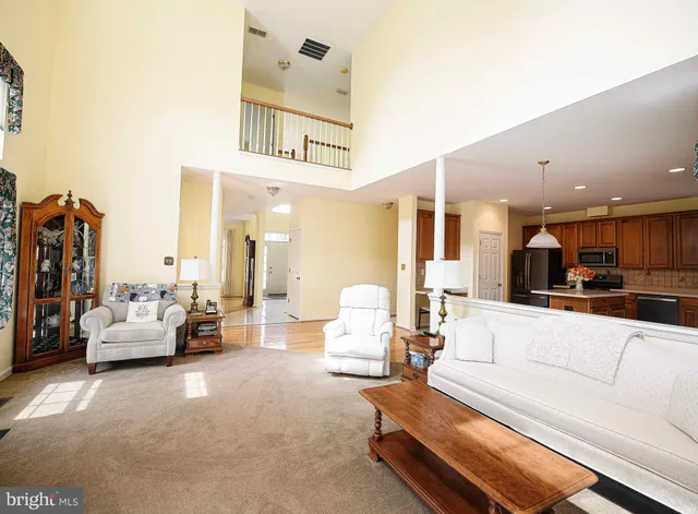 a living room with furniture fireplace and flat screen tv