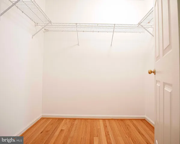 a view of balcony with wooden floor and fence