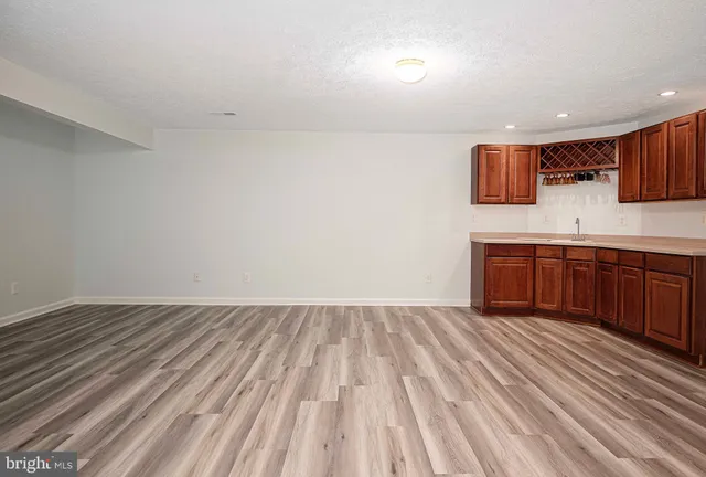 a bunch of flowers in front of the house