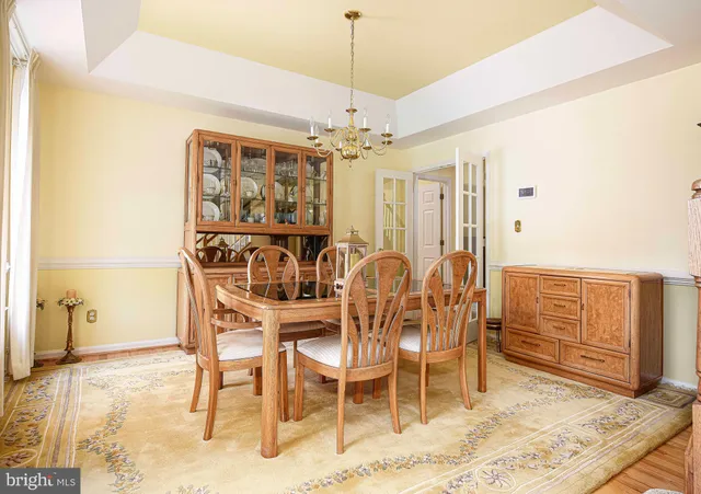 a living room with furniture a fireplace and a large window