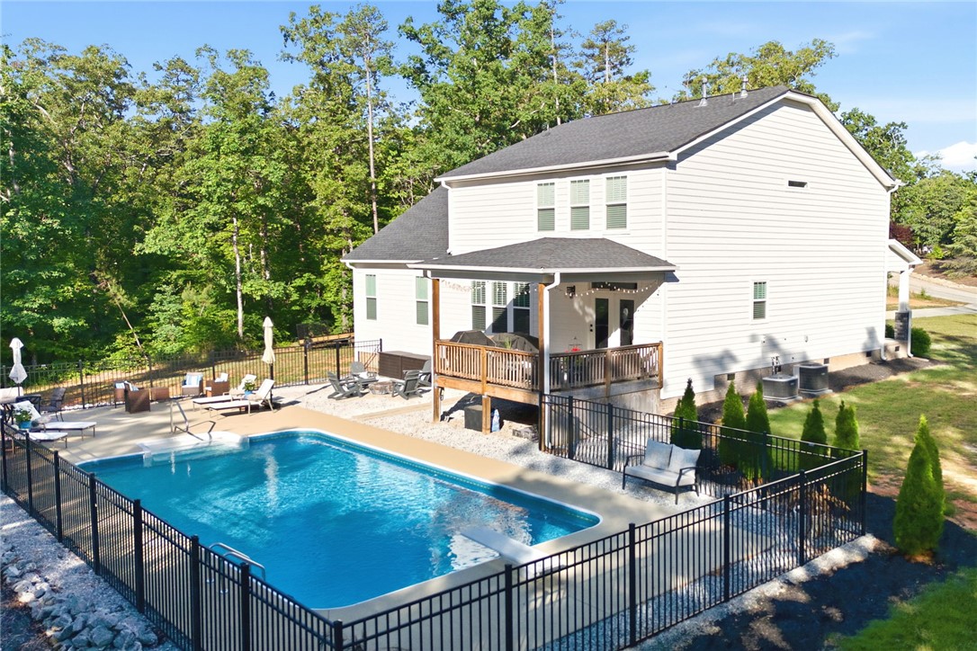 525 16th Circle Walhalla, SC 29691 - Photo 36 of 50 This spacious property features a refreshing pool, a comfortable deck, and lush trees.