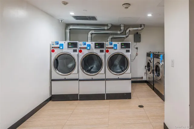 a view of a storage & utility room with washer and dryer