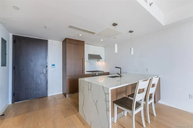 a kitchen with a table and chairs