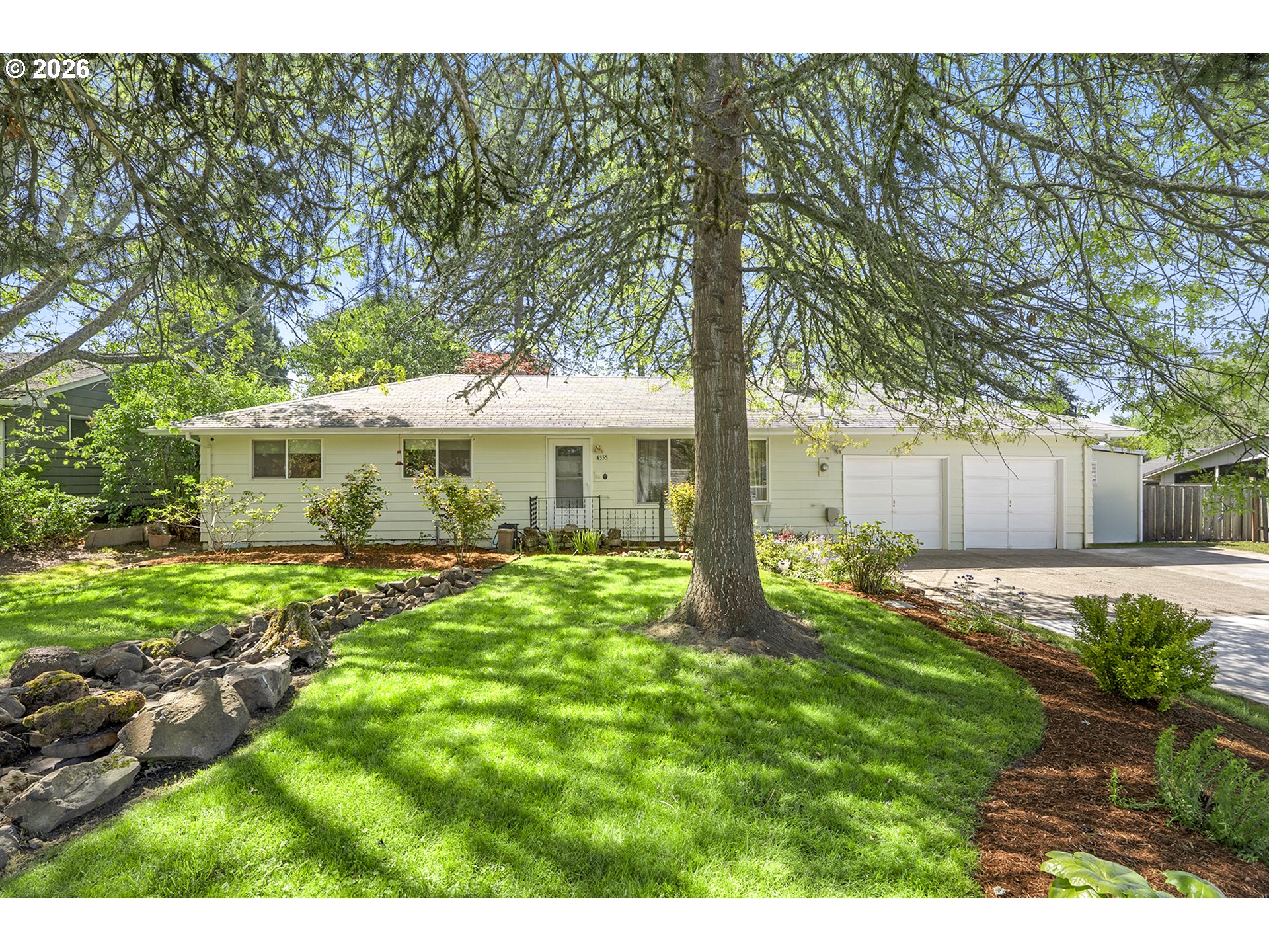 4355 Southwest 188th Avenue Beaverton, OR 97078 - Photo 1 of 42 a front view of a house with garden