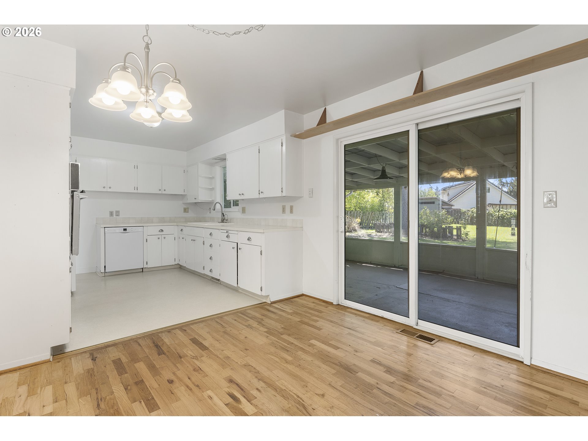 4355 Southwest 188th Avenue Beaverton, OR 97078 - Photo 11 of 42 a kitchen with granite countertop a stove and white cabinets