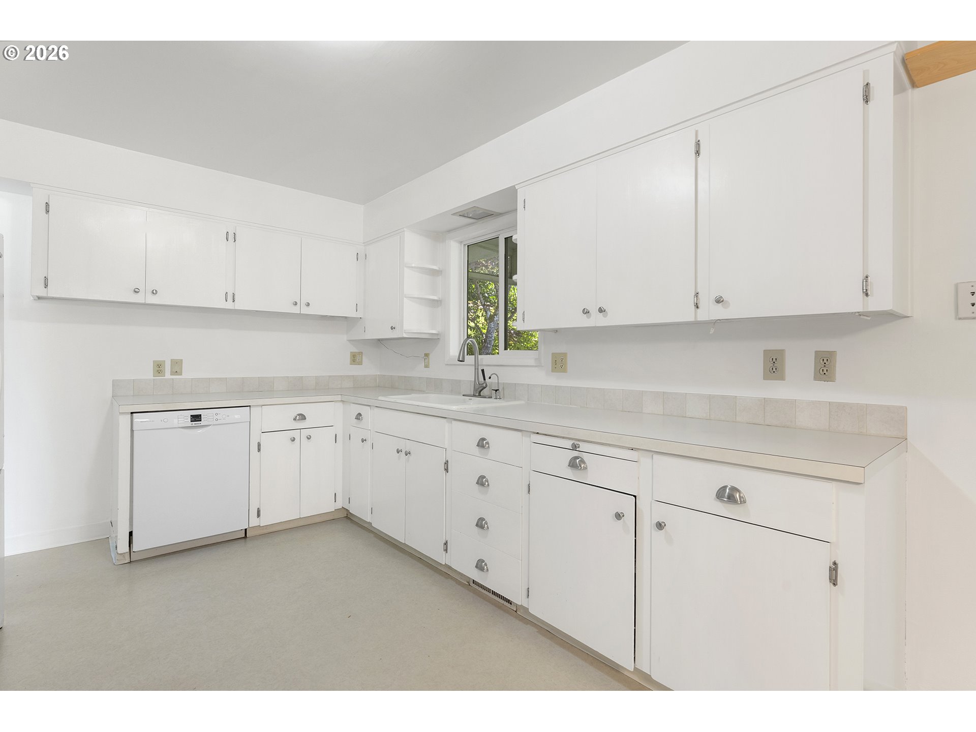 4355 Southwest 188th Avenue Beaverton, OR 97078 - Photo 14 of 42 a kitchen with granite countertop white cabinets and white appliances