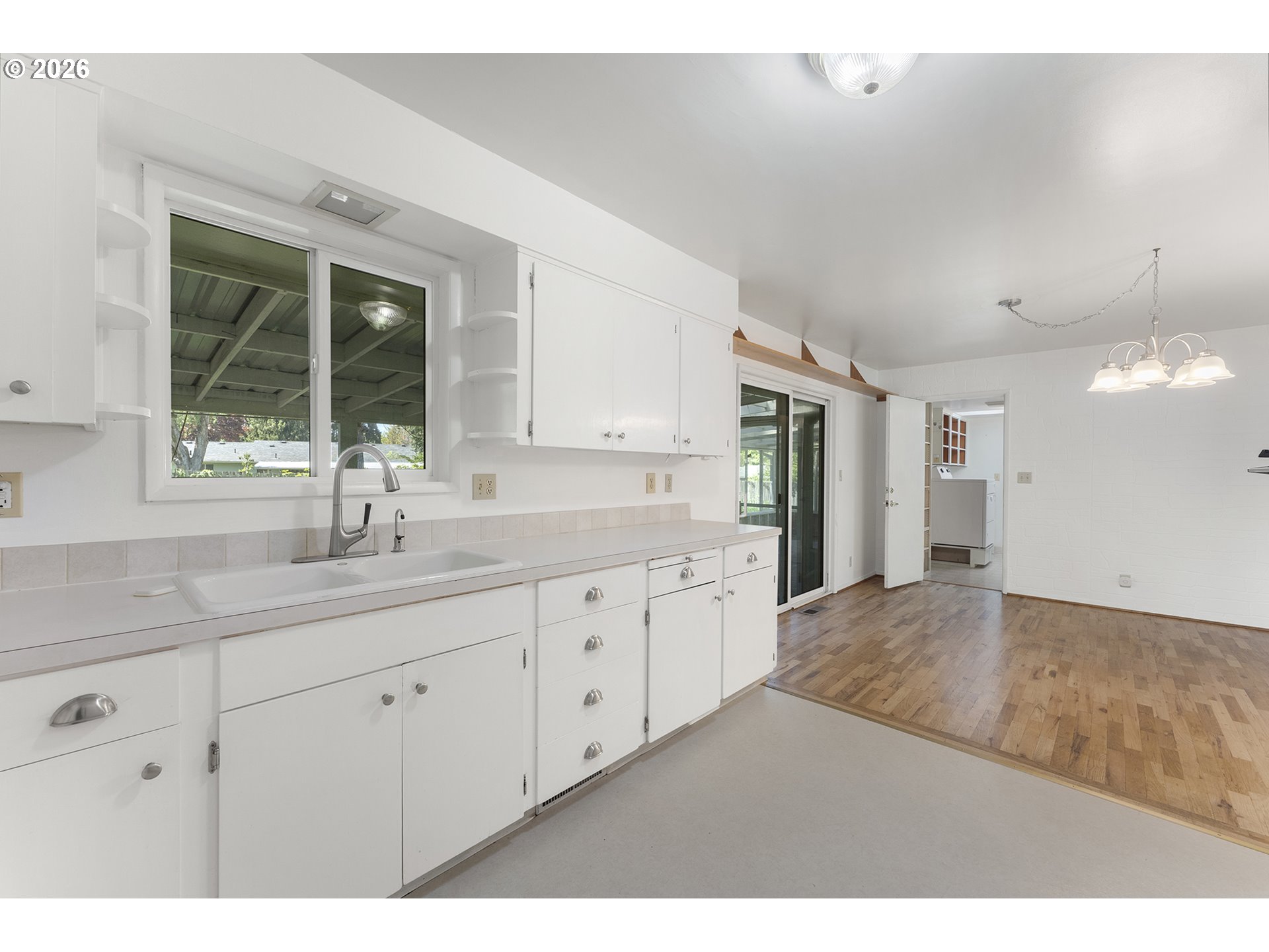 4355 Southwest 188th Avenue Beaverton, OR 97078 - Photo 16 of 42 a kitchen with granite countertop a sink and a large mirror