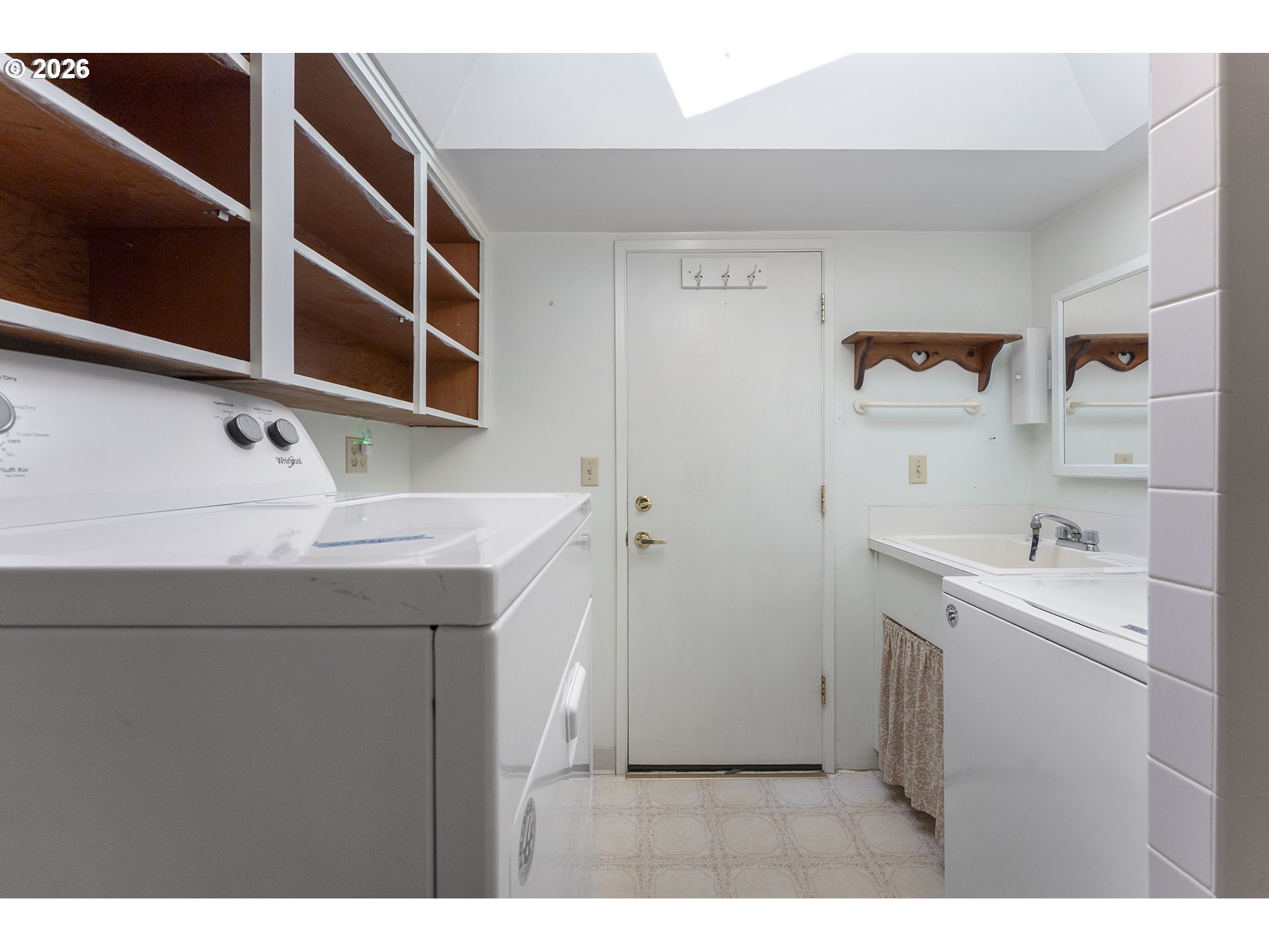 4355 Southwest 188th Avenue Beaverton, OR 97078 - Photo 18 of 42 a utility room with cabinets washer and dryer