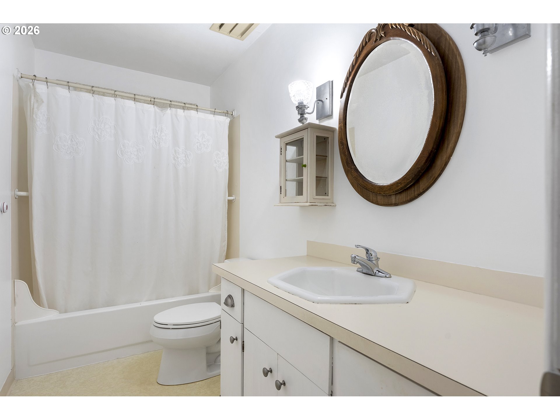 4355 Southwest 188th Avenue Beaverton, OR 97078 - Photo 23 of 42 a bathroom with a sink a toilet and a mirror
