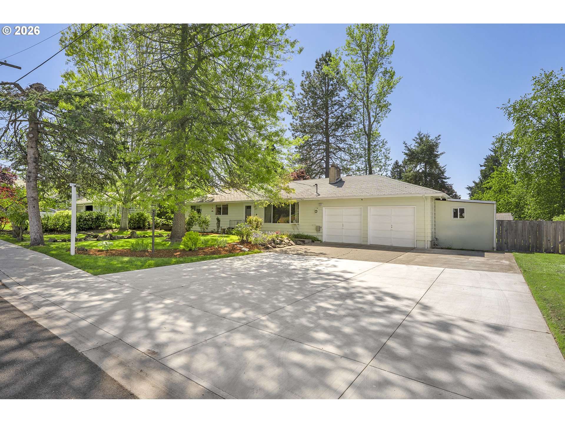 4355 Southwest 188th Avenue Beaverton, OR 97078 - Photo 4 of 42 a front view of a house with a yard and garage