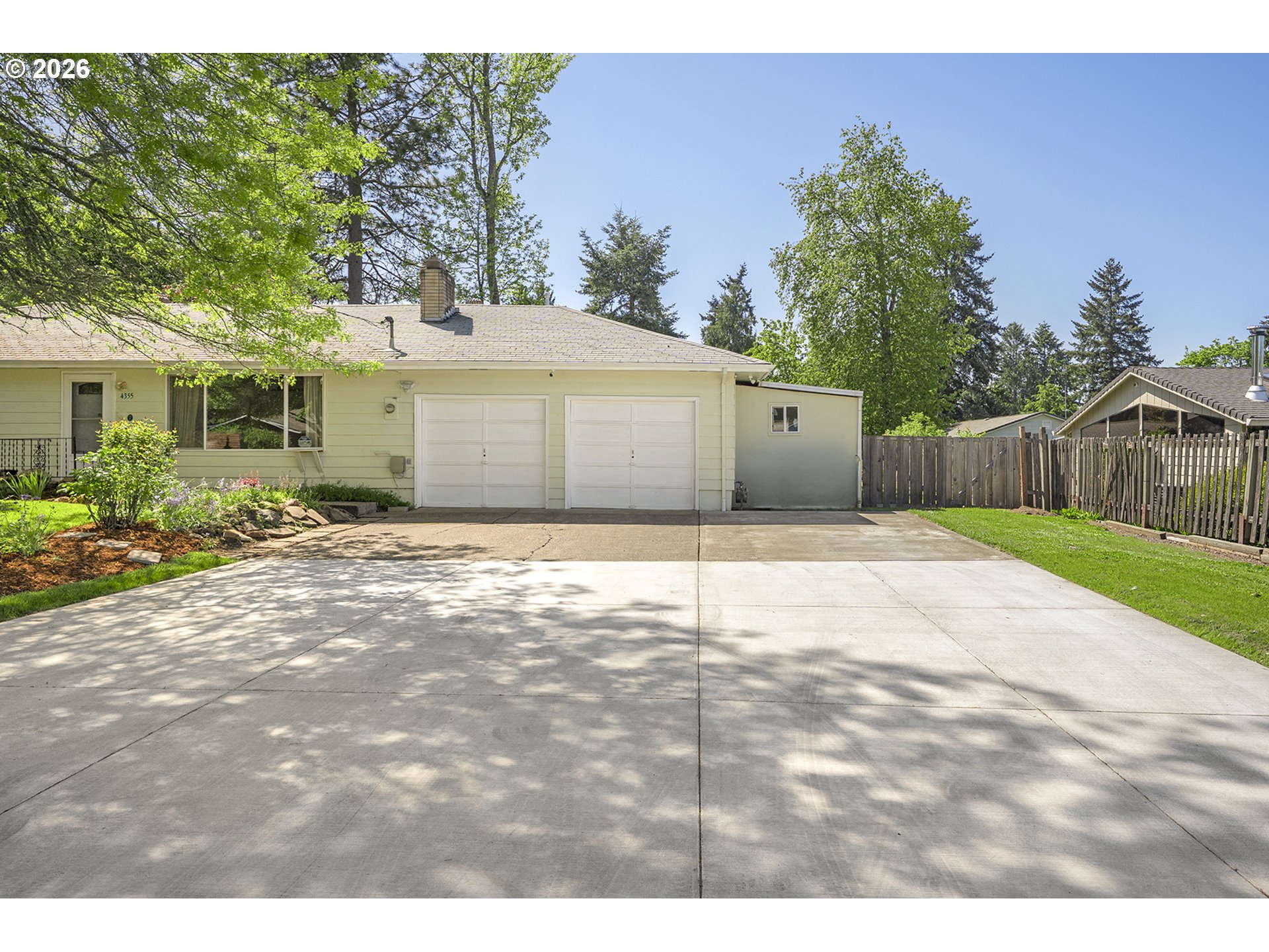 4355 Southwest 188th Avenue Beaverton, OR 97078 - Photo 5 of 42 a front view of a house with a yard and garage