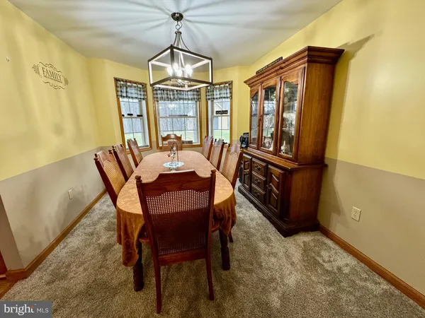 a view of a livingroom with furniture and closet