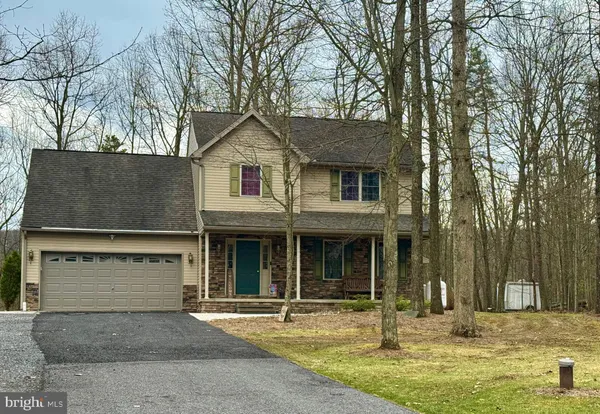a view of a white house with a sink and yard