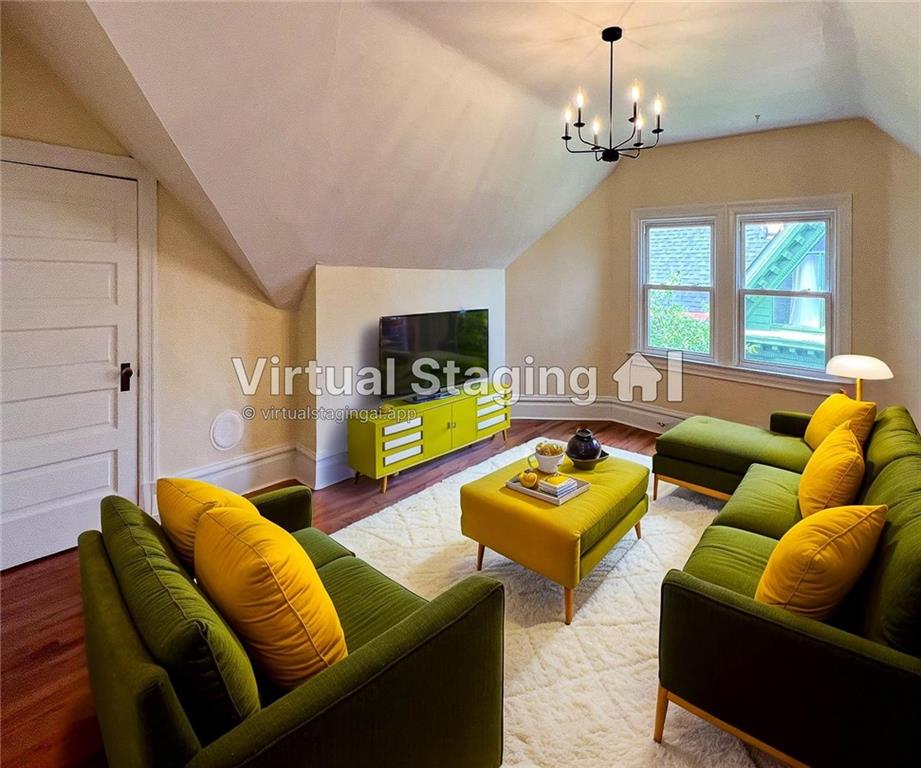 926 Savannah Avenue, Unit 3 Pittsburgh, PA 15221 - Photo 3 of 13 a living room with furniture and a flat screen tv