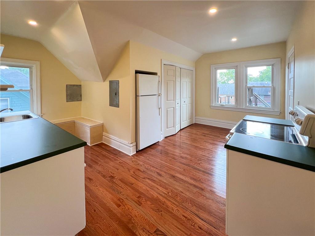 926 Savannah Avenue, Unit 3 Pittsburgh, PA 15221 - Photo 4 of 13 a view of a kitchen cabinets and wooden floor
