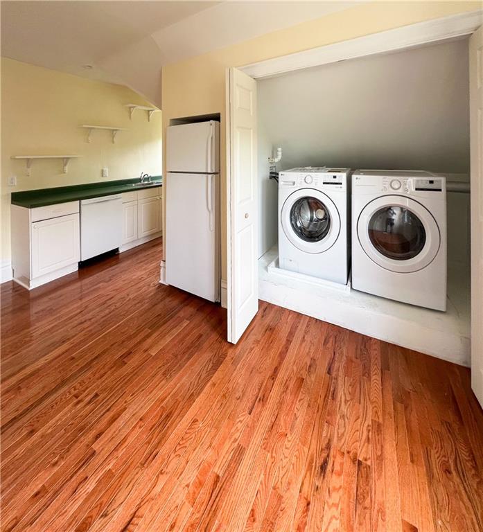 926 Savannah Avenue, Unit 3 Pittsburgh, PA 15221 - Photo 6 of 13 a view of kitchen and utility room with wooden floor