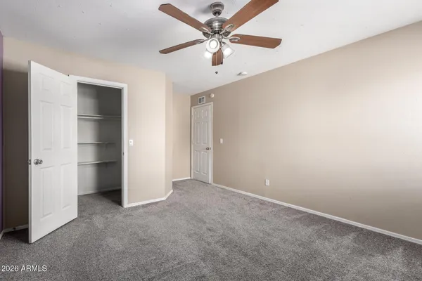 a bathroom with a granite countertop sink mirror toilet and bathtub