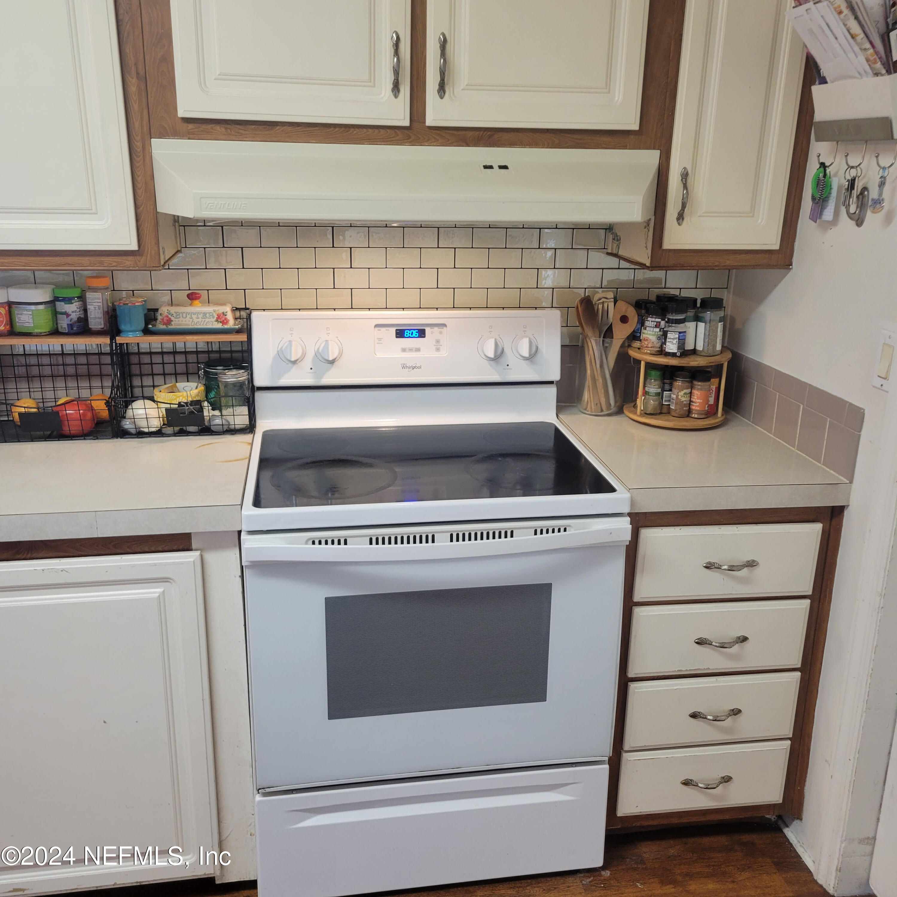 7616 Townsend Road Jacksonville, FL 32244 - Photo 16 of 38 a stove top oven sitting inside of a kitchen