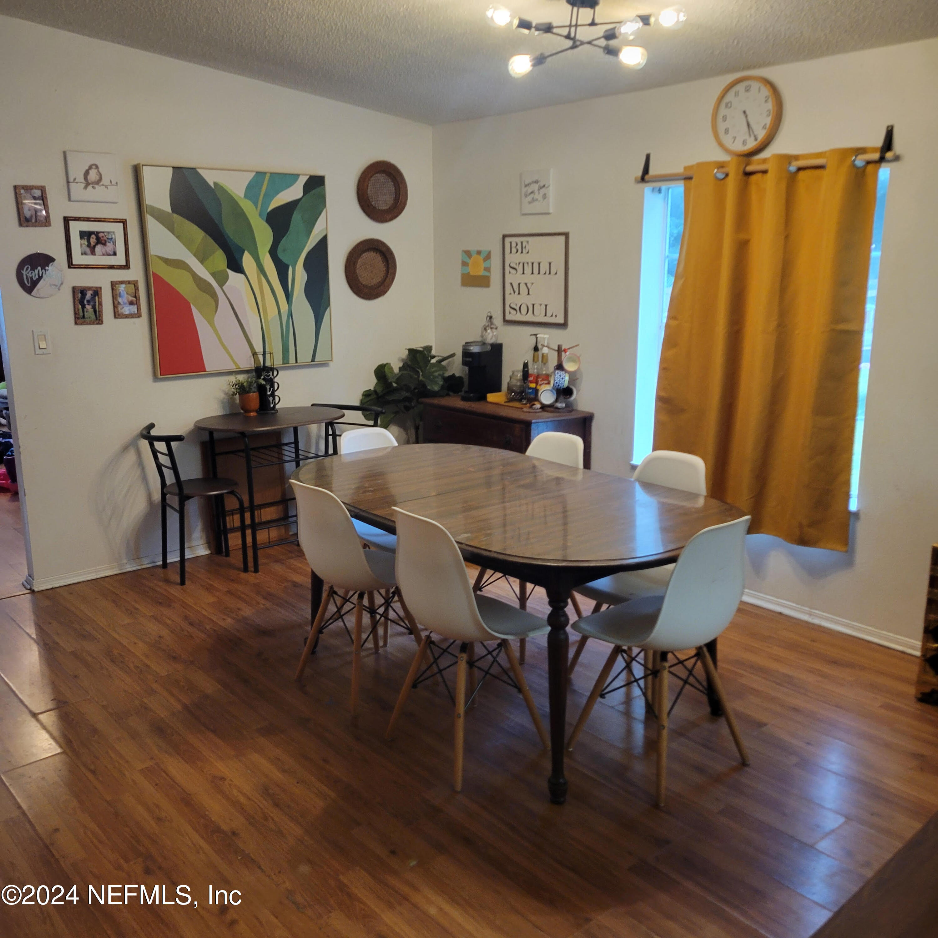 7616 Townsend Road Jacksonville, FL 32244 - Photo 24 of 38 a view of a dining room with furniture and wooden floor