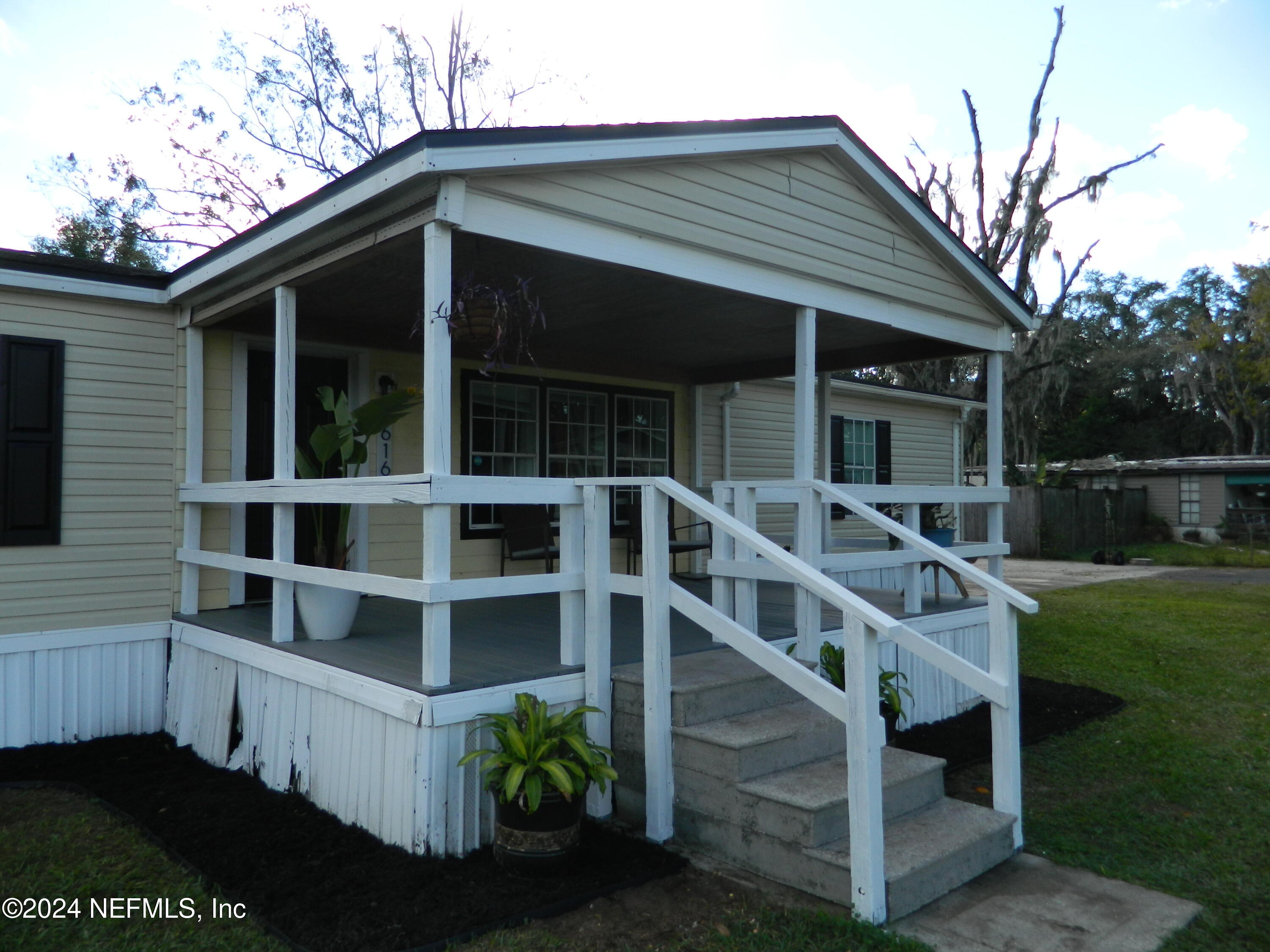 7616 Townsend Road Jacksonville, FL 32244 - Photo 3 of 38 a front view of a house with balcony