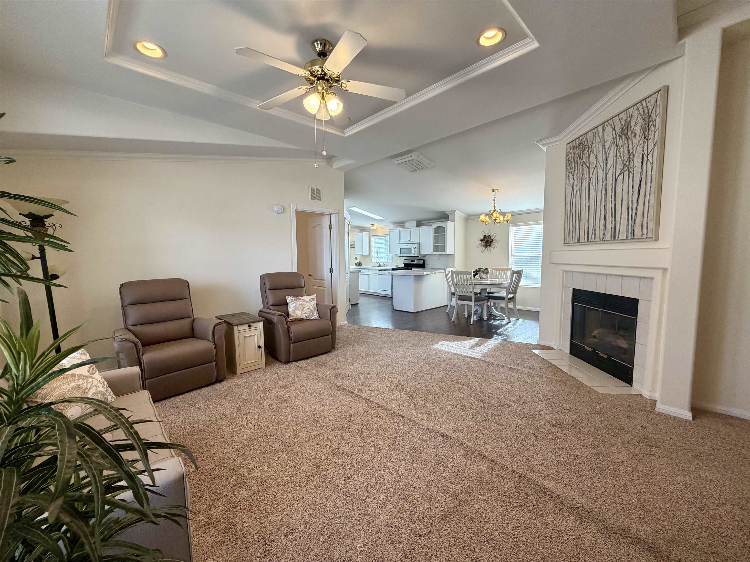 435 32 Road, Unit 480 Clifton, CO 81520 - Photo 7 of 23 a living room with furniture and a fireplace