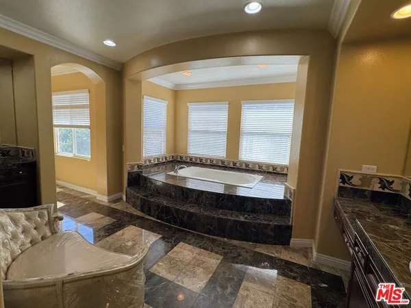 a bathroom with a tub and a sink