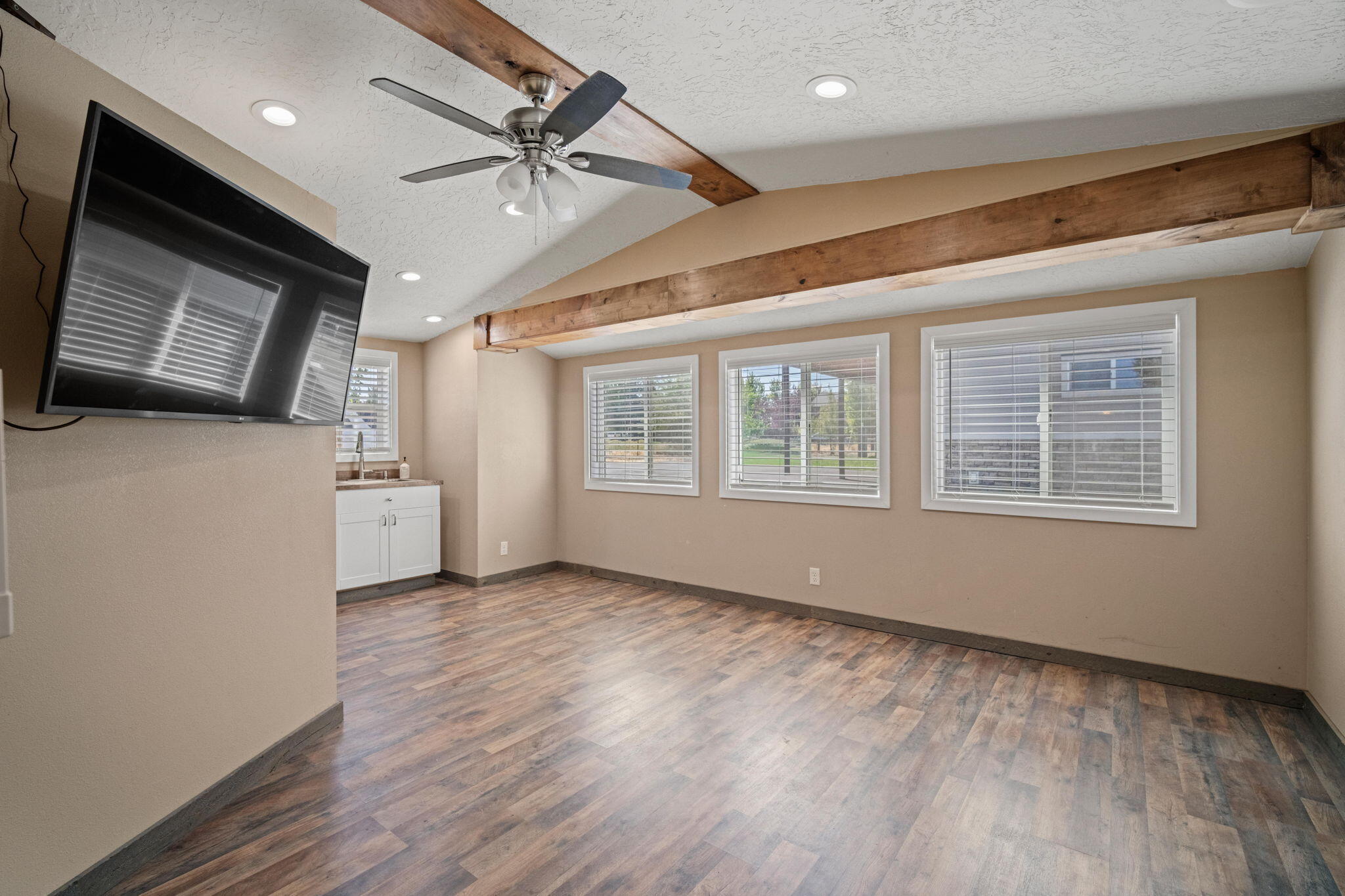 62466 Eagle Road Bend, OR 97701 - Photo 67 of 93 a view of an empty room with a window and wooden floor