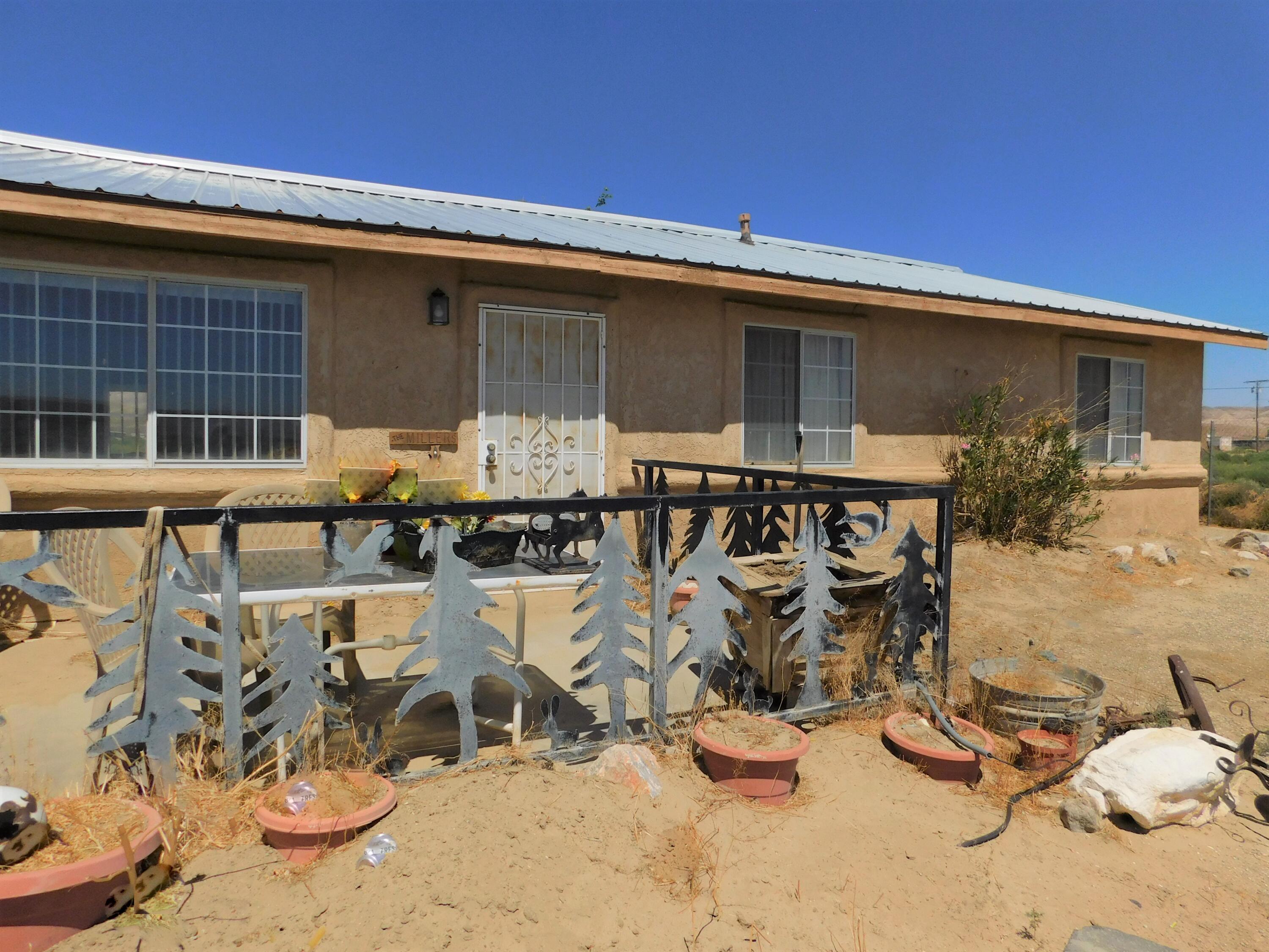 31601 Neuralia Road Mojave, CA 93519 - Photo 1 of 27 a front view of a house with patio