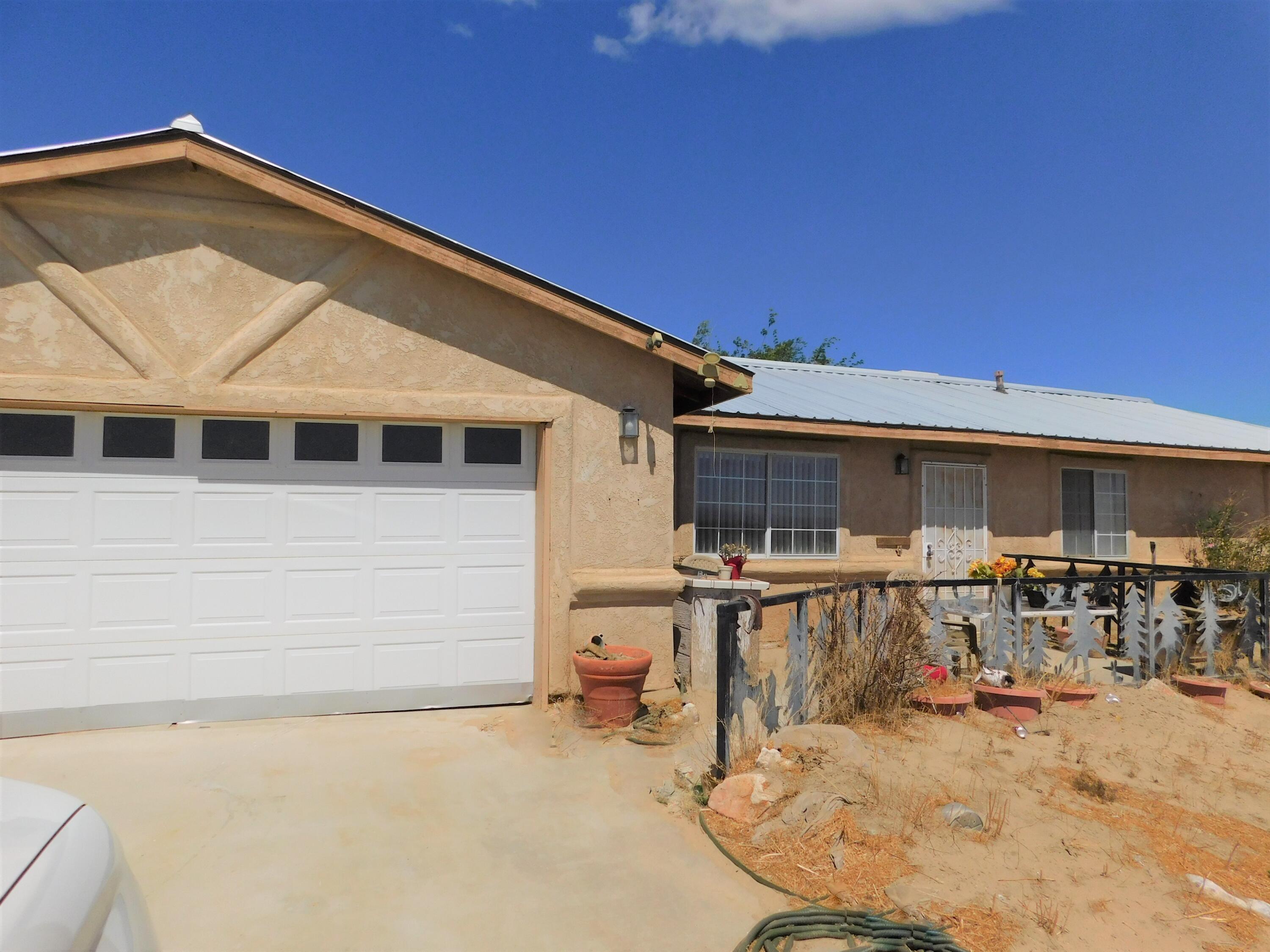 31601 Neuralia Road Mojave, CA 93519 - Photo 24 of 27 a backyard of a house with table and chairs