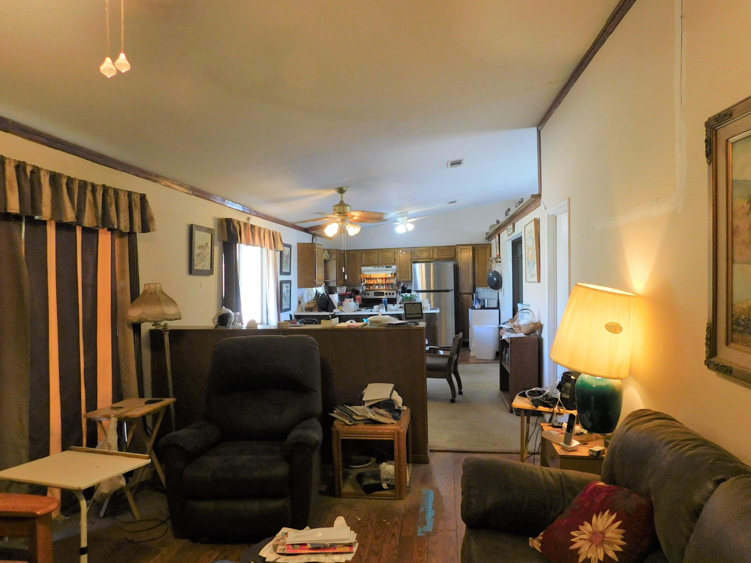 31601 Neuralia Road Mojave, CA 93519 - Photo 4 of 27 a living room with furniture and a flat screen tv