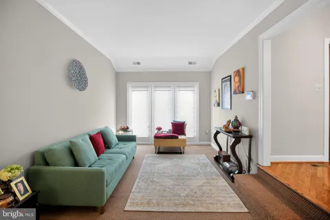a living room with furniture and a rug
