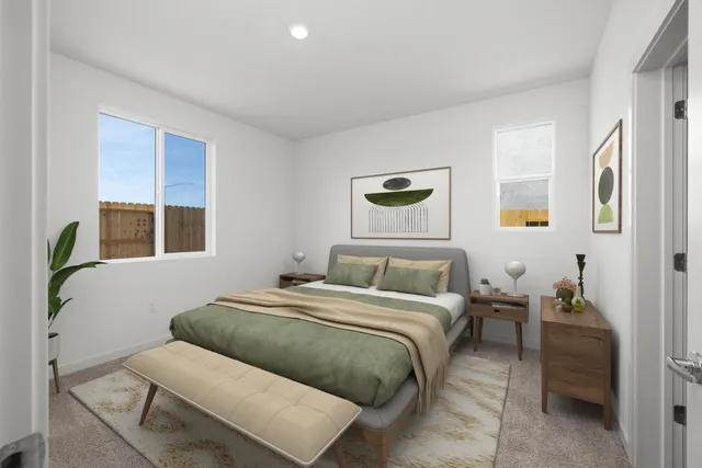 a bedroom with a bed and window