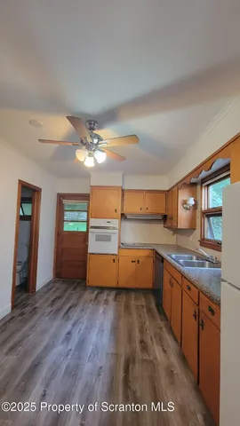 a kitchen with stainless steel appliances granite countertop a sink and cabinets