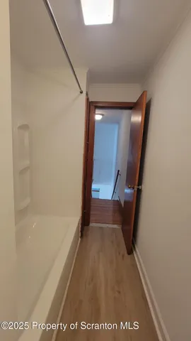 a view of entryway with wooden floor