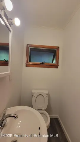 a bathroom with a toilet and a sink
