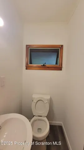 a bathroom with a toilet and a sink