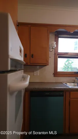 a kitchen with a sink and a microwave