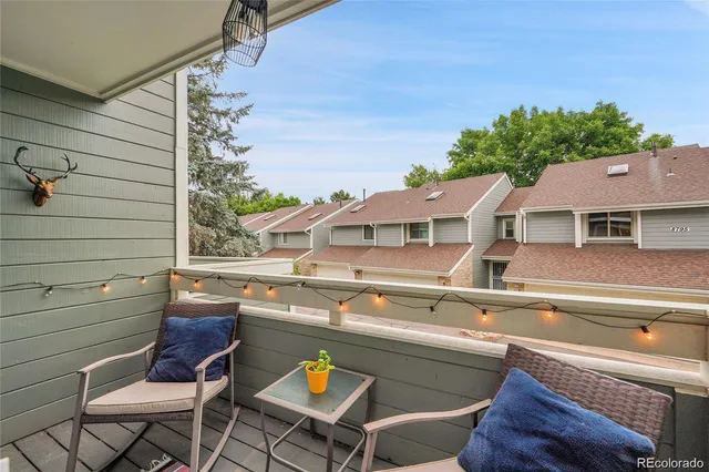 a view of balcony with wooden floor