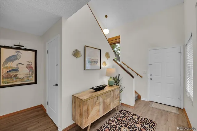 a room with furniture and wooden floor