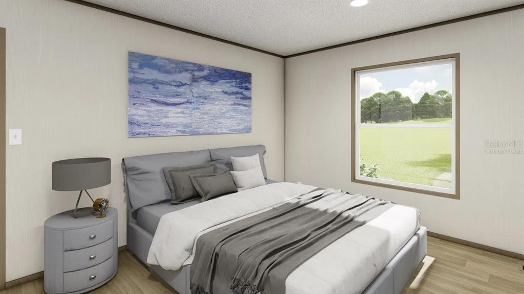 33242 Forest Ridge Road DeLand, FL 32720 - Photo 7 of 15 a bedroom with a bed and window with chair